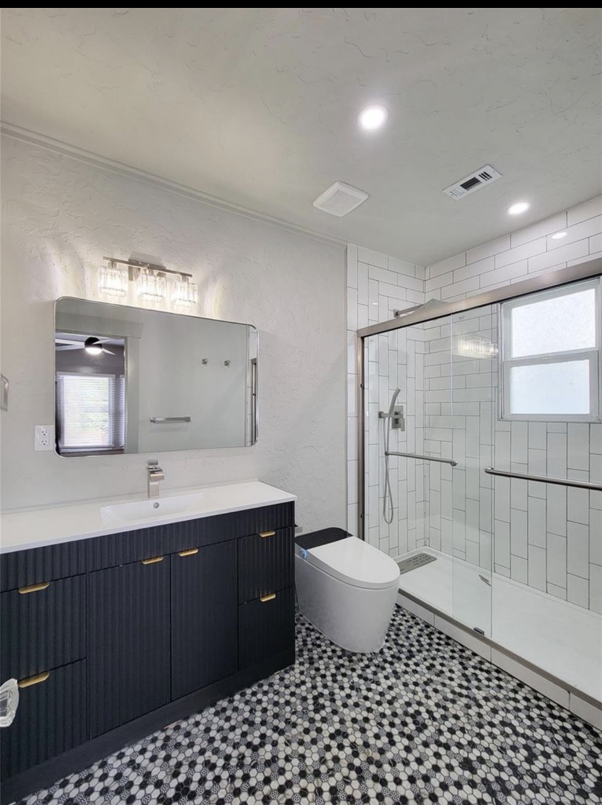 Completed bathroom remodeling project by Interior E Construction
