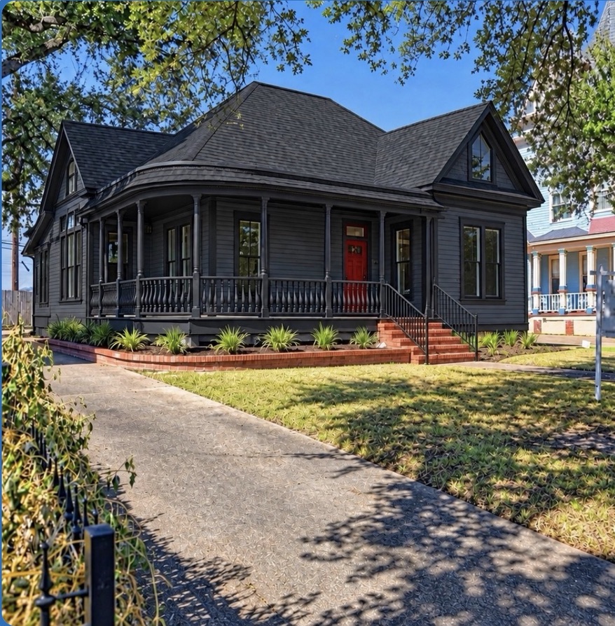 Completed dark exterior remodeling with red front door